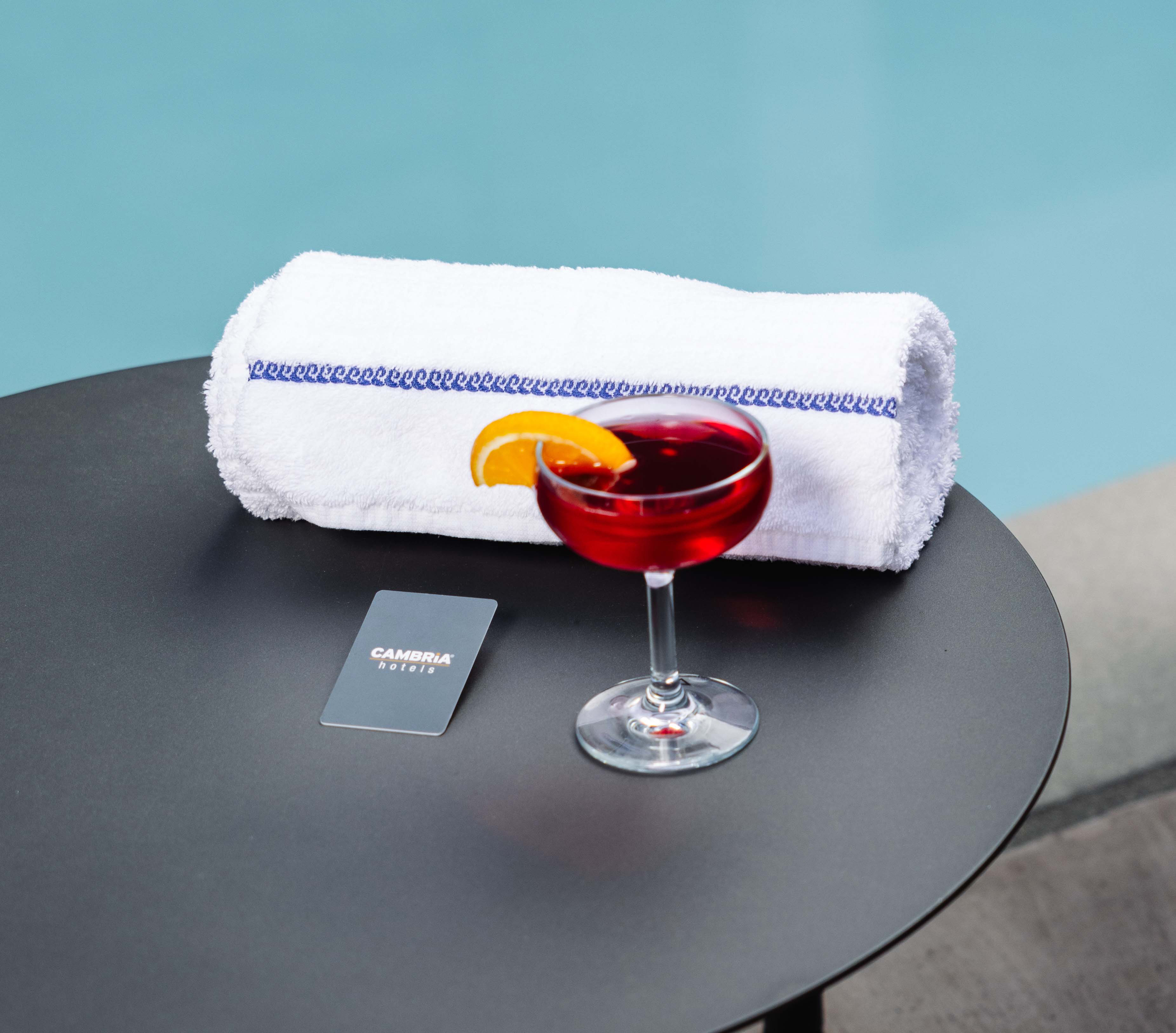 a drink and towel on a table