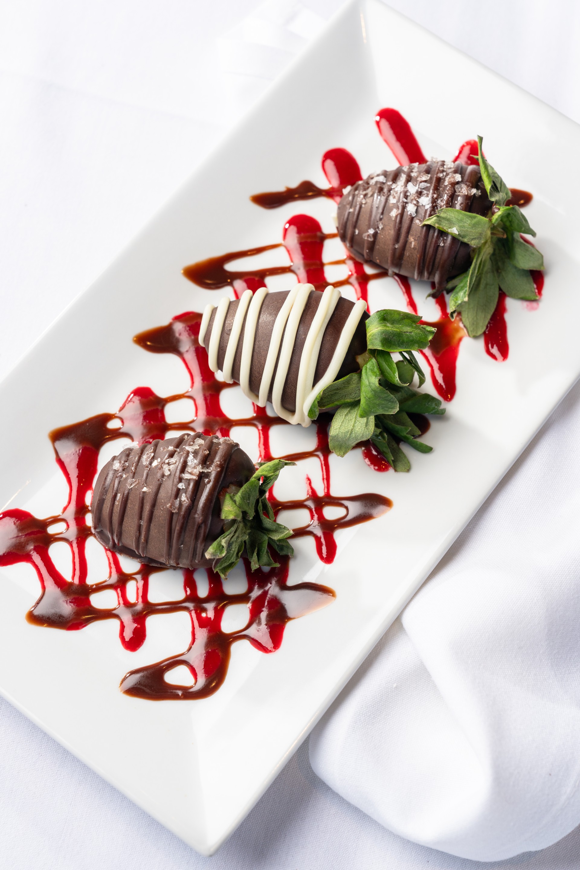 chocolate covered strawberries on a plate
