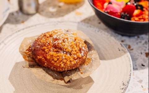 a plate of food and a bowl of fruit