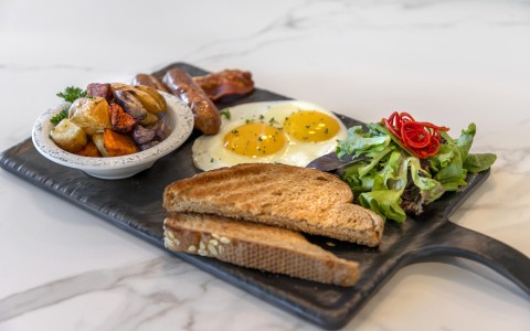 a plate of food on a marble surface