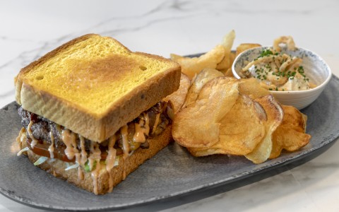 a plate of food with a sandwich and fries