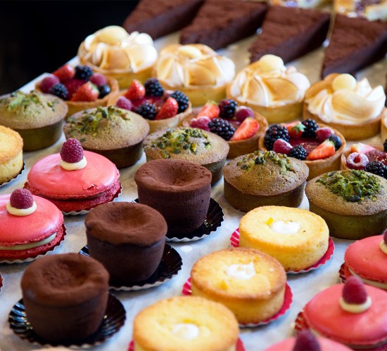 a tray of pastries and desserts