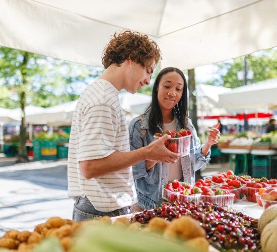 a man and woman at a market