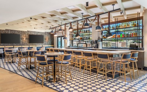 a bar with tables and chairs