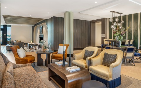 a room with a large table and chairs
