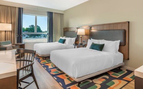 a hotel room with two beds