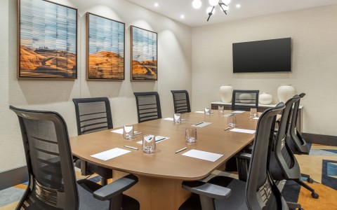 a conference room with a table and chairs