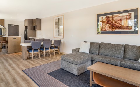 a living room with a couch and a table