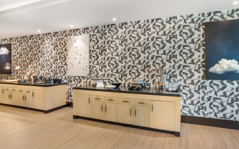 a room with a black and white wallpaper