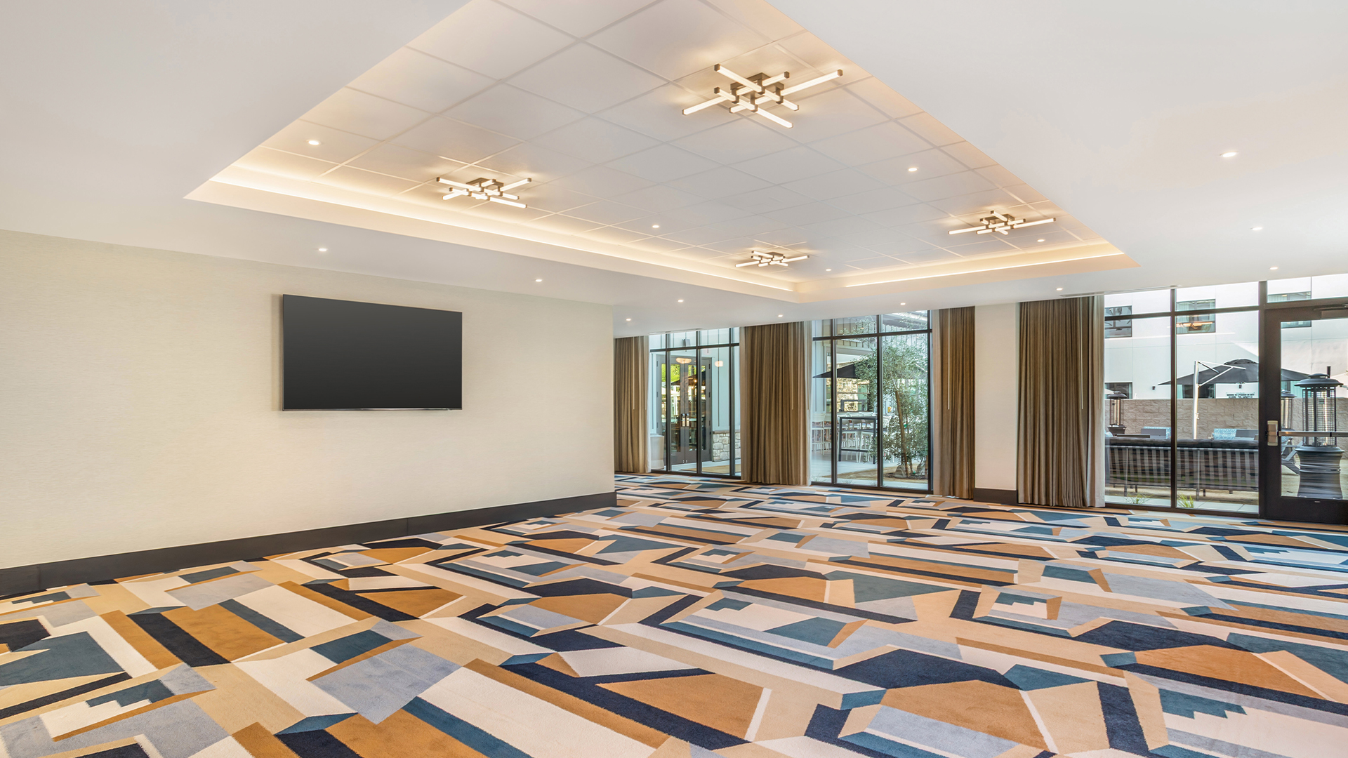 a room with a television on the wall