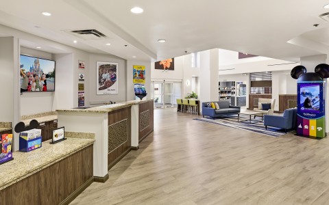 a lobby with a reception desk and chairs