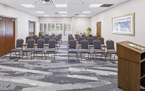 a room with chairs and a podium