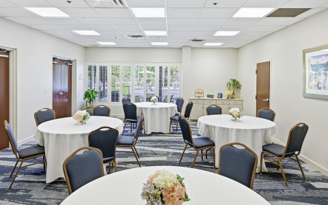 a room with tables and chairs