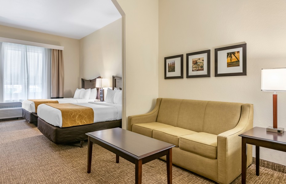 double queen beds with couch in the next room