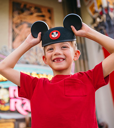 a boy wearing a hat with ears