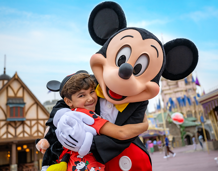 a boy hugging a person in a garment