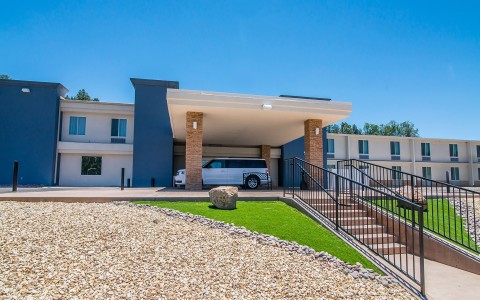 a white van parked in front of a building
