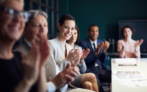 a group of people clapping