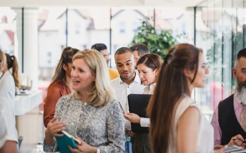 a group of people standing in a room