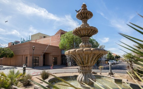 a fountain in front of a building