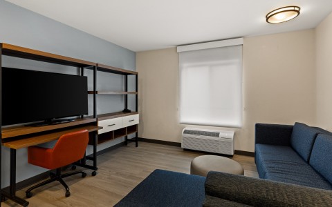 a room with a couch and a tv