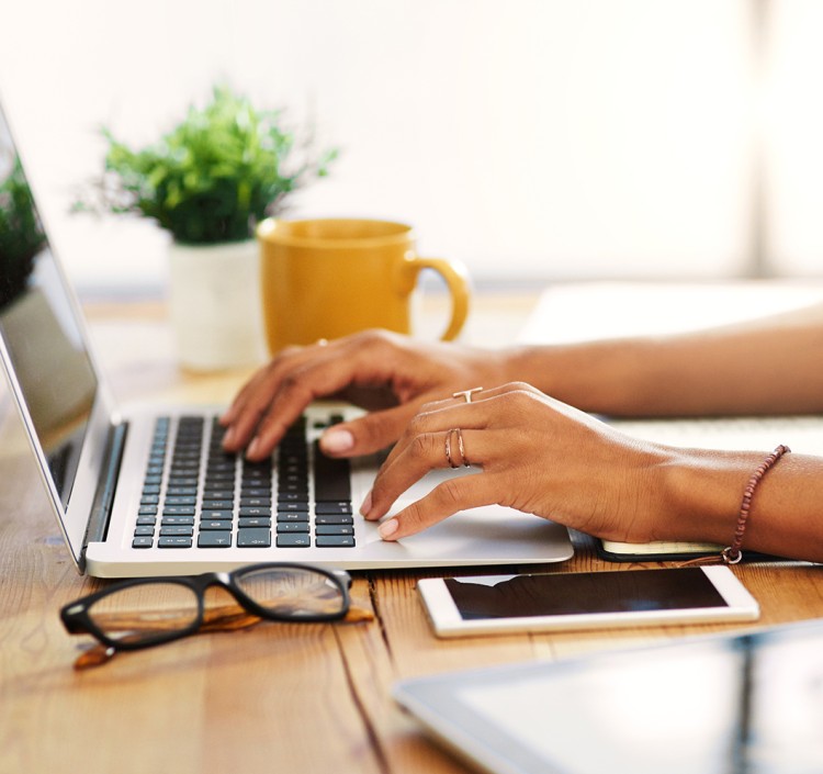 a person typing on a laptop