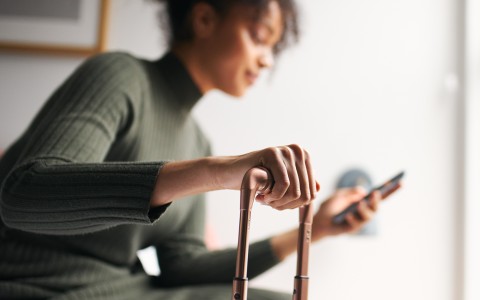 a woman holding a phone