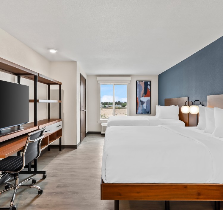 a room with a bed and a desk
