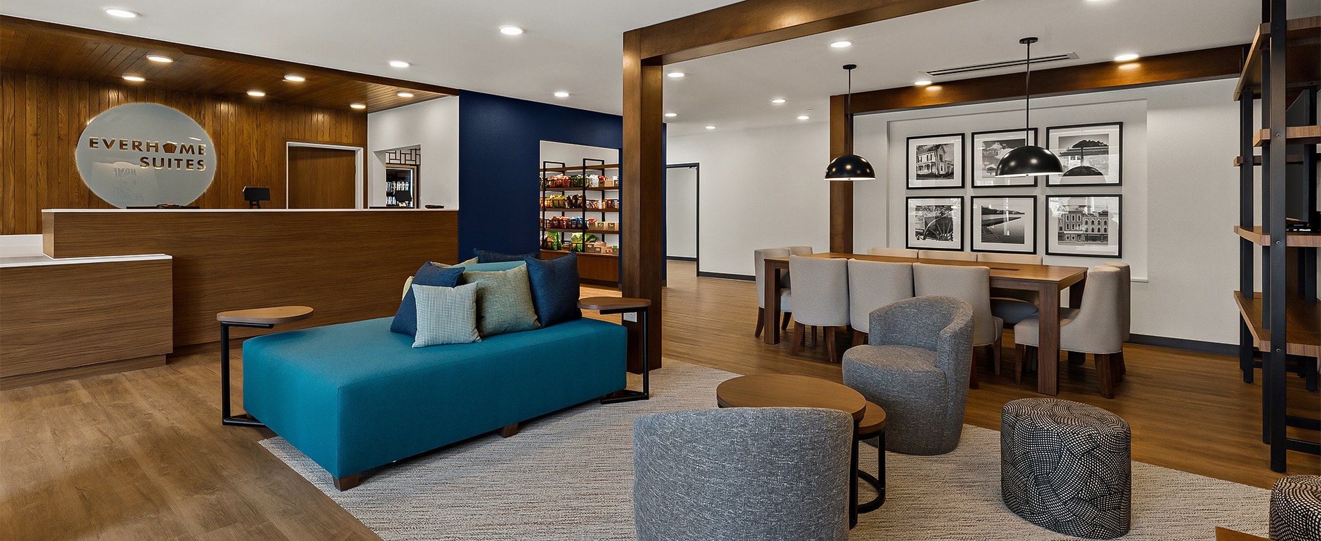 a room with a couch and chairs