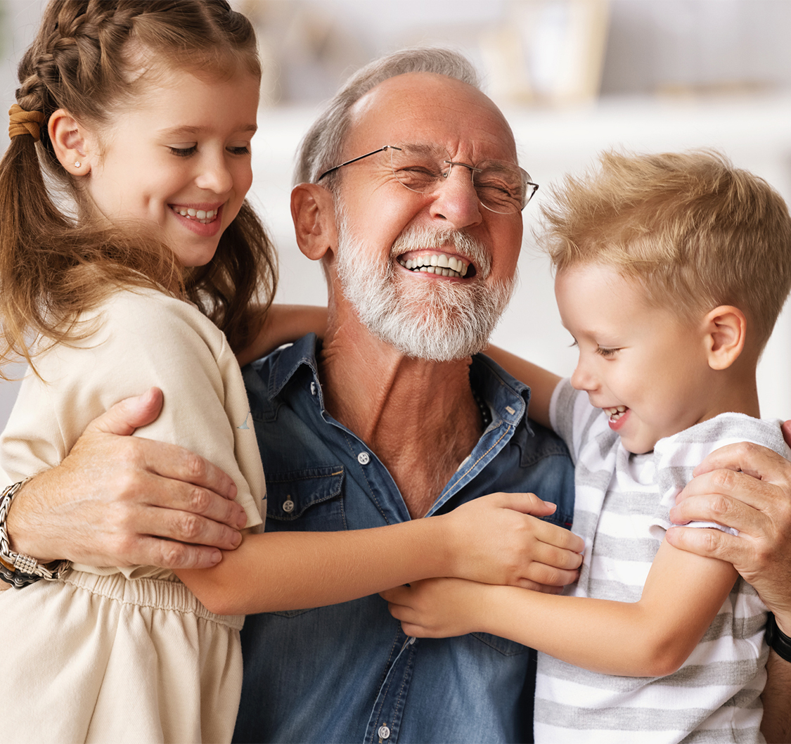 a man and children hugging