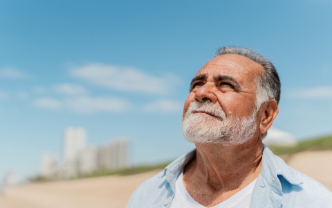 a man with a beard looking up