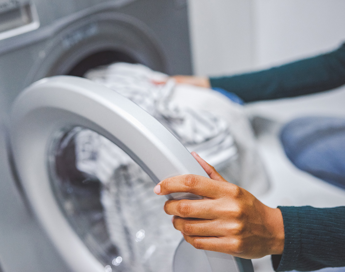 a person holding a washing machine
